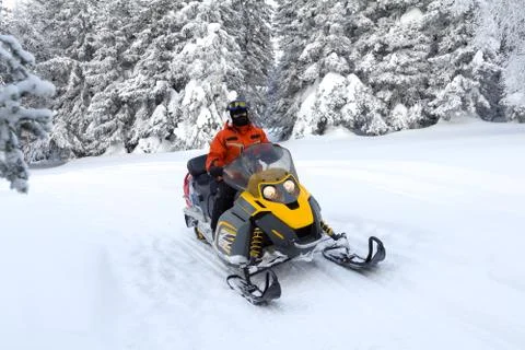 Athlete on a snowmobile. Stock Photos