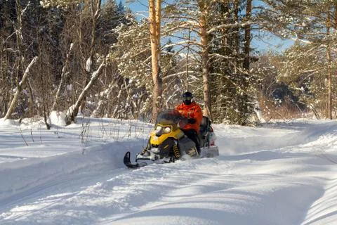 Athlete on a snowmobile. Stock Photos