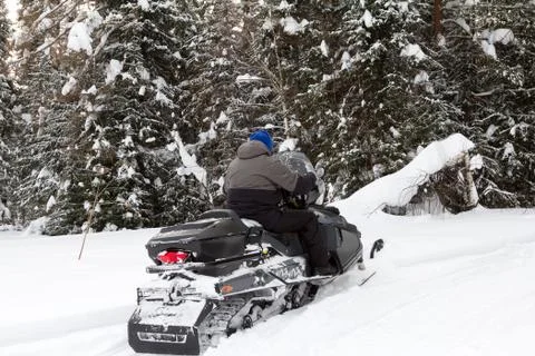 Athlete on a snowmobile. Stock Photos