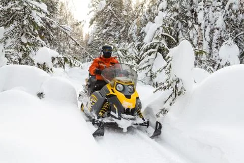 Athlete on a snowmobile. Stock Photos