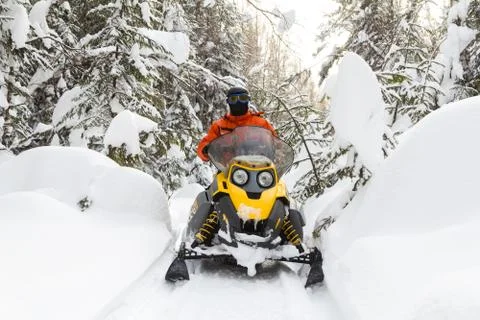 Athlete on a snowmobile. Stock Photos