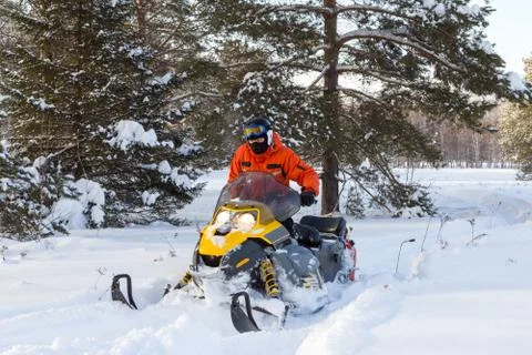 Athlete on a snowmobile. Stock Photos