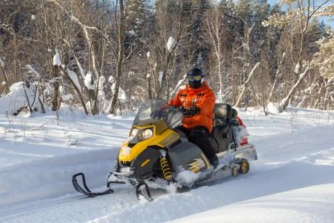 Athlete on a snowmobile. Stock Photos