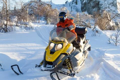 Athlete on a snowmobile. Stock Photos