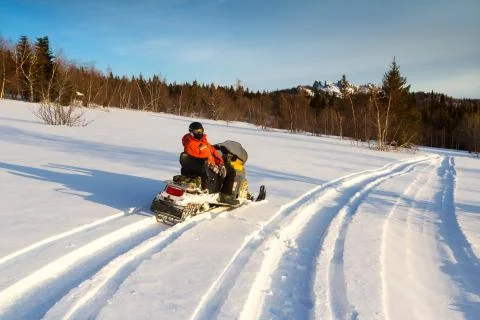 Athlete on a snowmobile. Stock Photos