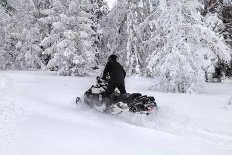Athlete on a snowmobile Stock Photos