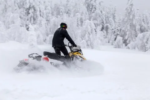 Athlete on a snowmobile Stock Photos
