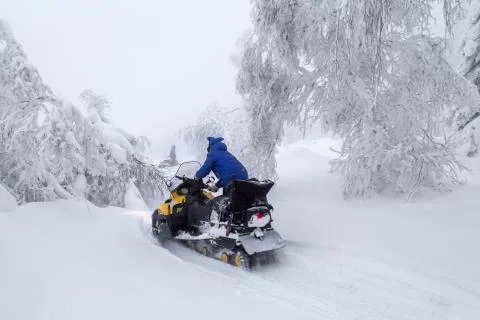 Athlete on a snowmobile Stock Photos
