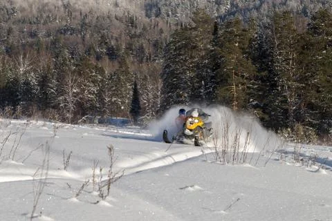 Athlete on a snowmobile Stock Photos