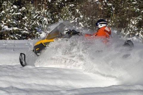 Athlete on a snowmobile Stock Photos