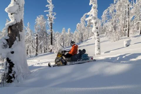 Athlete on a snowmobile Stock Photos