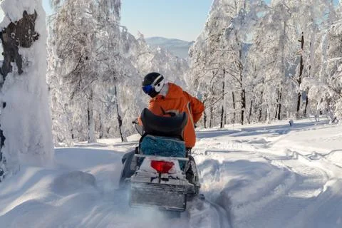 Athlete on a snowmobile Stock Photos
