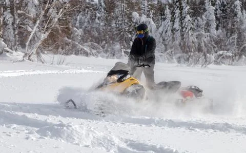 Athlete on a snowmobile Stock Photos