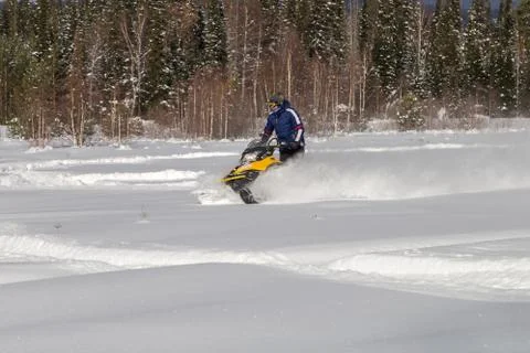 Athlete on a snowmobile Stock Photos