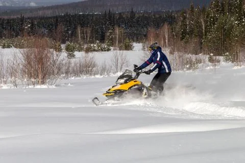 Athlete on a snowmobile Stock Photos