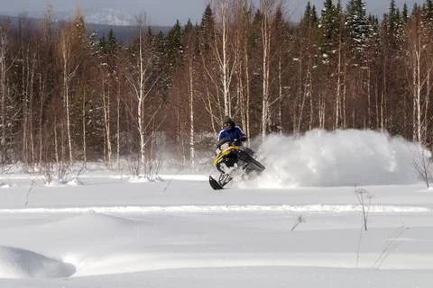 Athlete on a snowmobile Stock Photos