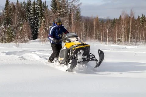 Athlete on a snowmobile Stock Photos
