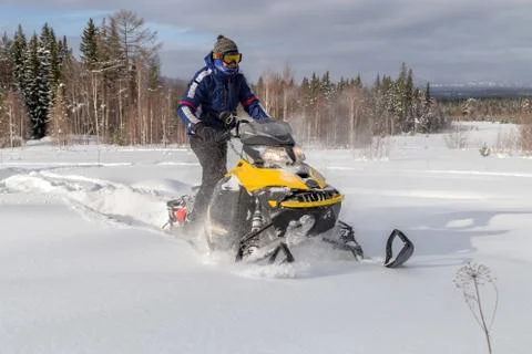 Athlete on a snowmobile Stock Photos