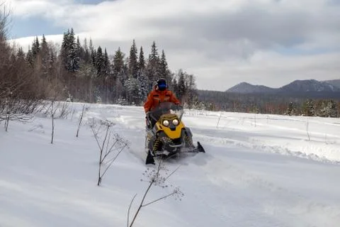 Athlete on a snowmobile Stock Photos
