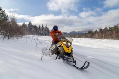 Athlete on a snowmobile Stock Photos
