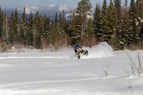 Athlete on a snowmobile Stock Photos