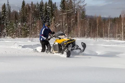 Athlete on a snowmobile Stock Photos