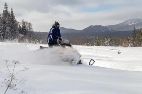 Athlete on a snowmobile Stock Photos