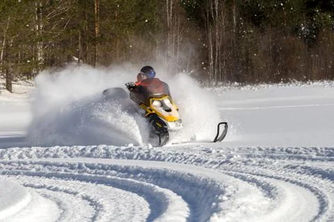 Athlete on a snowmobile Stock Photos