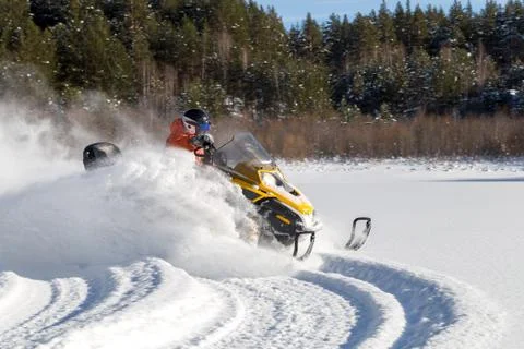 Athlete on a snowmobile Stock Photos