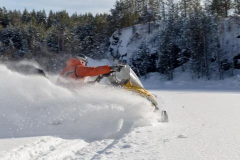 Athlete on a snowmobile Stock Photos