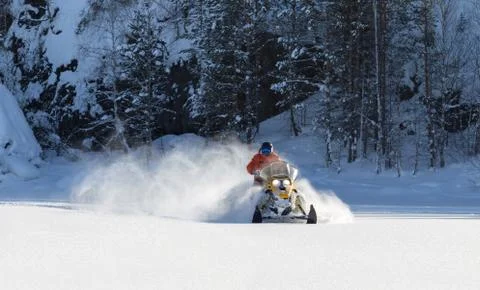 Athlete on a snowmobile Stock Photos