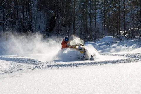 Athlete on a snowmobile Stock Photos