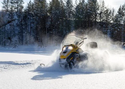 Athlete on a snowmobile Stock Photos