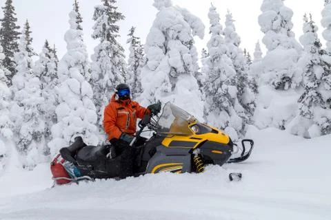 Athlete on a snowmobile Stock Photos