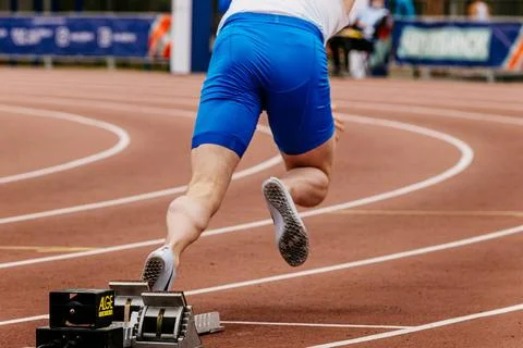 Athlete sprinter start running from starting blocks Alge-Timing Stock Photos