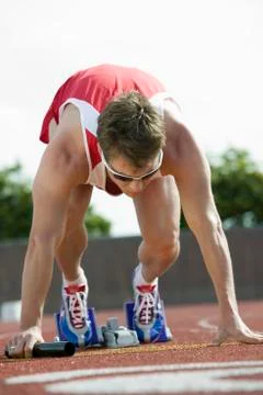 Athlete In Starting Blocks With Baton Stock Photos