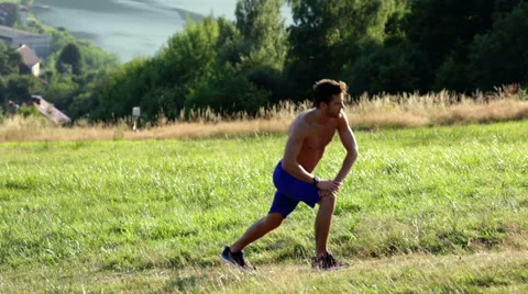 Athlete stretching during running workout in mountains Stock Footage 55866349