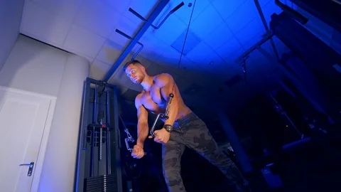 Athlete with strong body doing work out pushing up excercise in gym.  Stock Footage 119151930