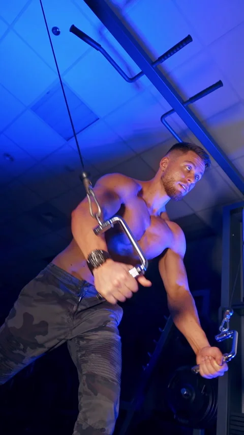 Athlete with strong body doing work out pushing up excercise in gym.  Stock Footage 296432333