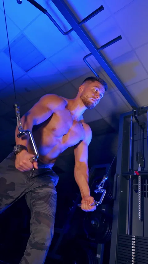 Athlete with strong body doing work out pushing up excercise in gym. Video stock 296432368