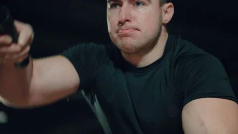 Athlete sweating while working out with battle ropes in gym Stock Footage 148327751