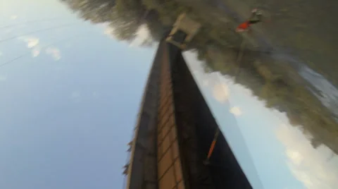 Athlete swings the pendulum under the bridge after the jump Stock Footage 34363445