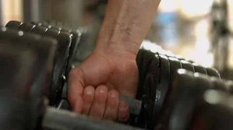 Athlete takes a dumbbell for training. Stock Footage 61465230