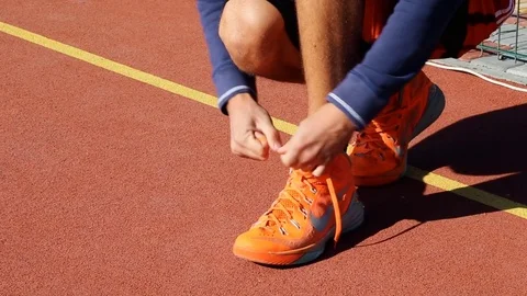 Athlete ties laces Stock Footage 82977220
