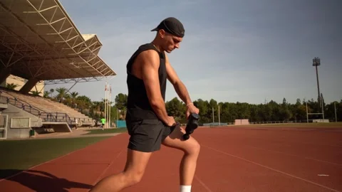 Athlete in a training centre getting a shock massage with a massage gun. Ph.. Stock Footage 267894478