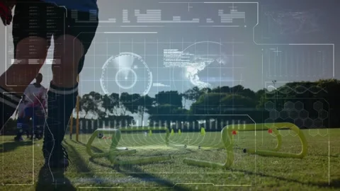 Athlete training on field with digital data processing animation overlay Stock Footage 328715537