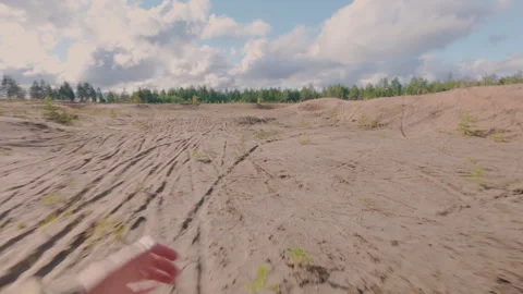 The athlete trains in the forest, running on soft ground under load. Stockbeeldmateriaal 342383387