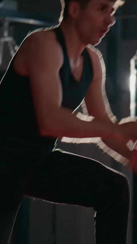 Athlete trains hard in dim, dramatic lighting Stock Footage 335506434