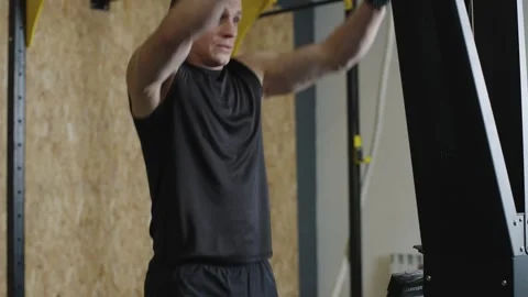 Athlete trains with pull-ups for strength in fitness studio Stock-Footage 327078221