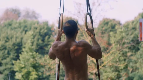 Athlete trains on the rings Video stock 99997694